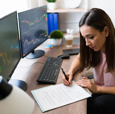 woman looking at financial details on her computer